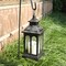 Indoor and outdoor decorative candle lanterns made of vintage metal, perfect for front porches, patios, wedding parties, and Christmas décor (black with copper brush).